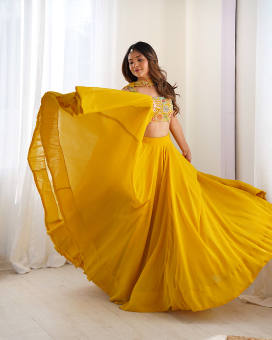 Yellow flowy lehenga with multicolor choli and matching dupatta