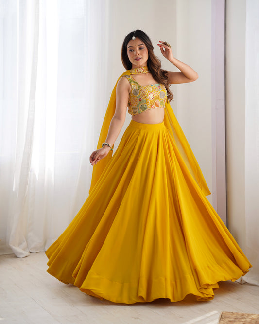 Yellow flowy lehenga with multicolor choli and matching dupatta
