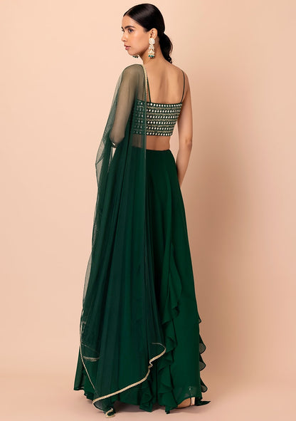Shop green ruffle lehenga with mirror work crop top and net dupatta
