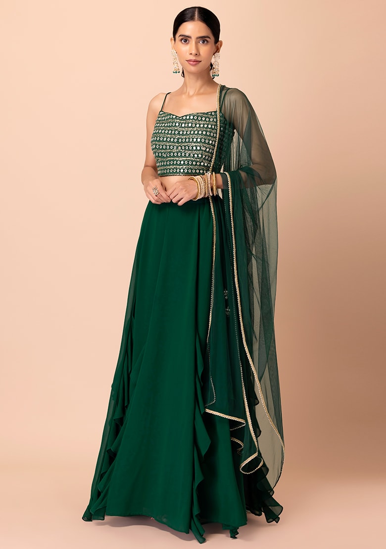 Shop green ruffle lehenga with mirror work crop top and net dupatta