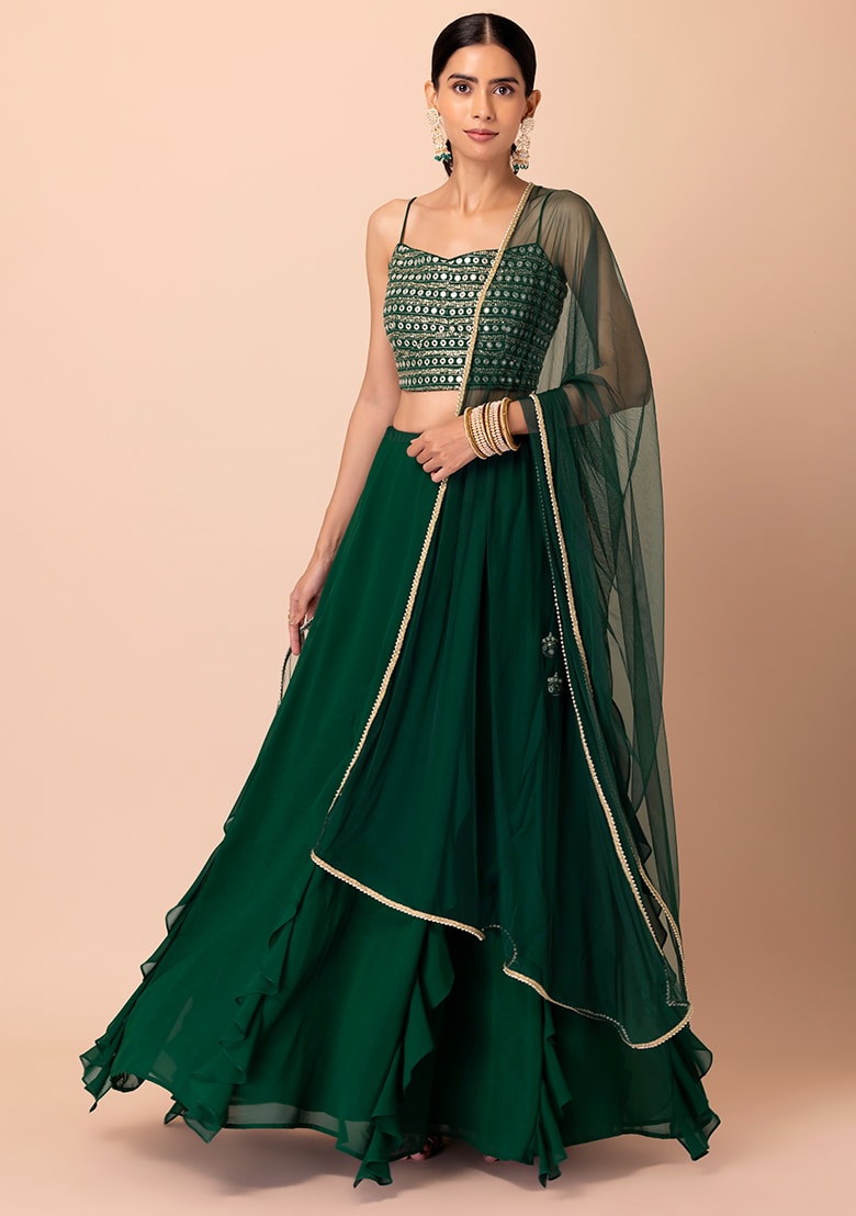 Dark green ruffle lehenga with mirror embroidered blouse and net dupatta

