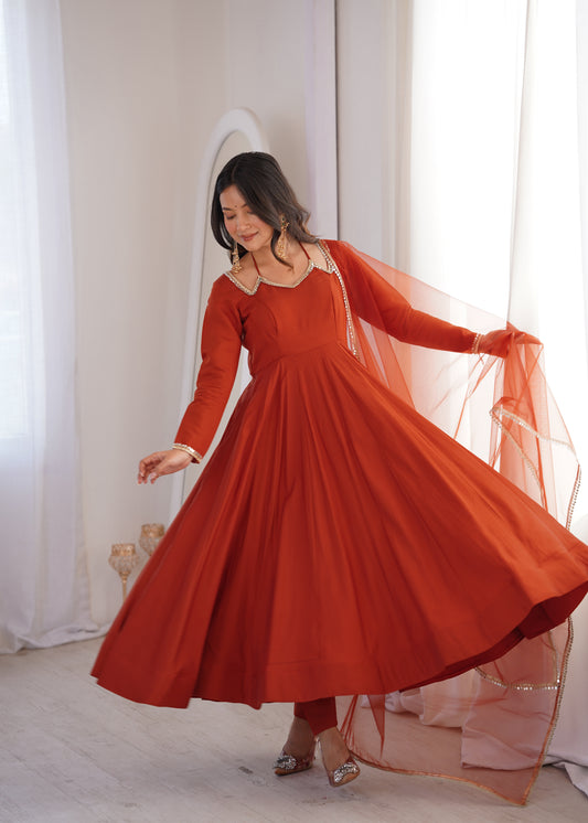 Rust Orange Roman Silk Chanderi Anarkali Gown with Net Dupatta & Mirror Lace