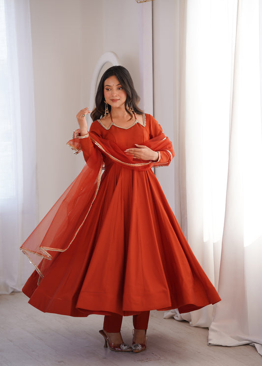 Rust Orange Roman Silk Chanderi Anarkali Gown with Net Dupatta & Mirror Lace