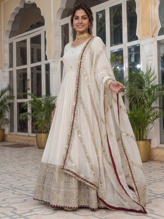 Elegant Off-White Silk Anarkali Dress with Heavy Golden Embroidery & Dupatta