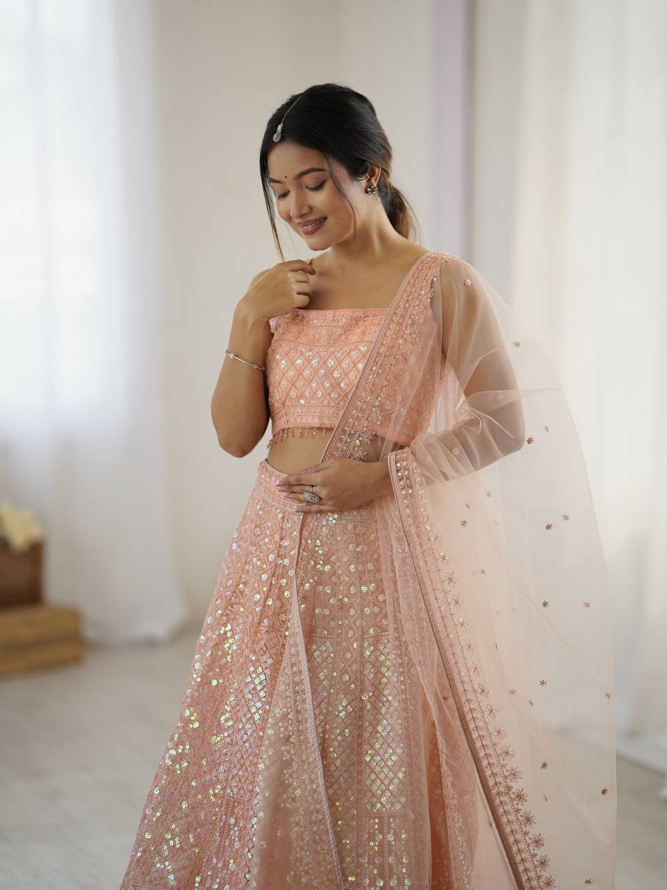 Elegant Peach Net Embroidered Lehenga Choli for Bridesmaids